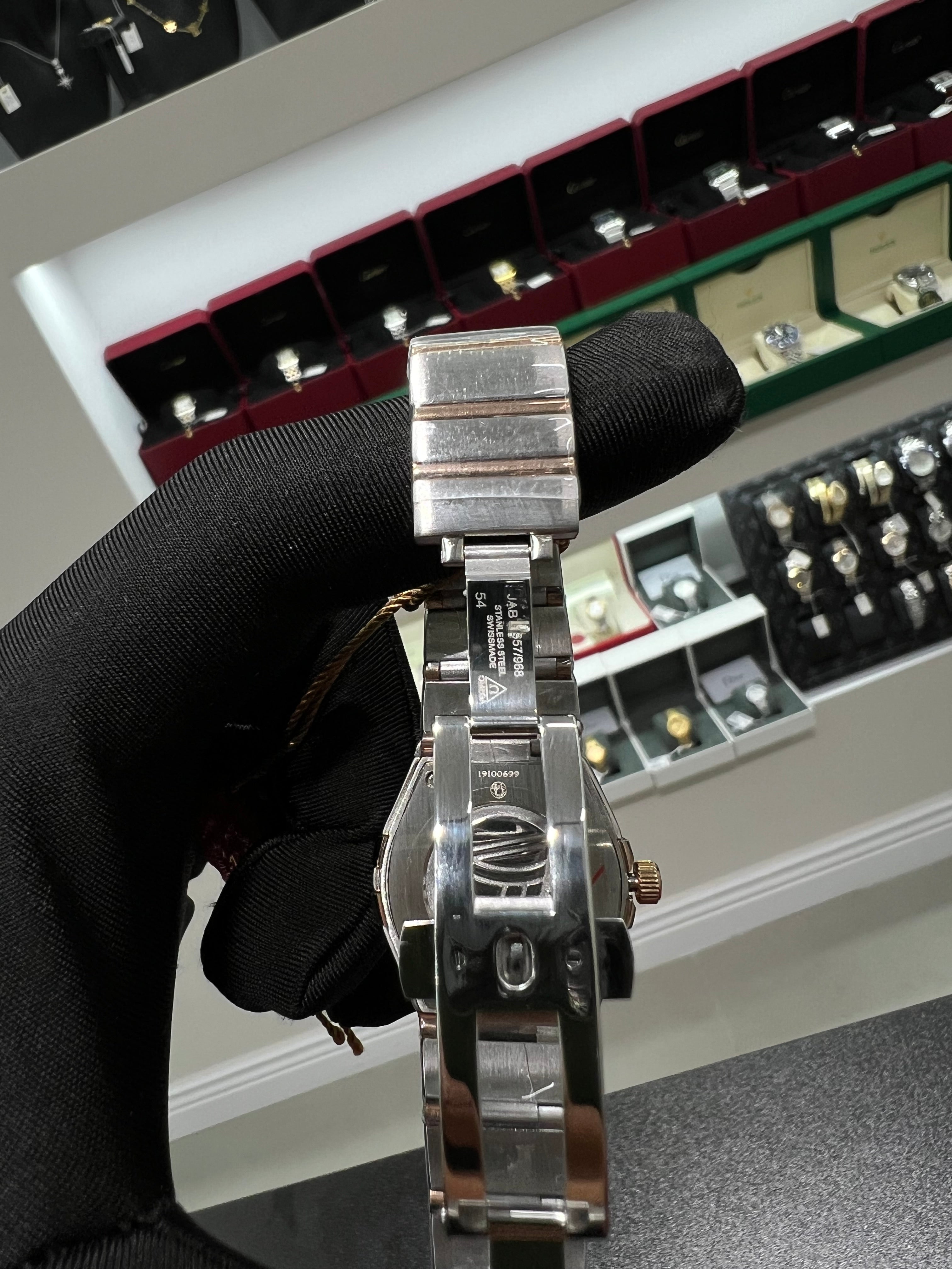 Constellation watch with a shiny honey-colored dial