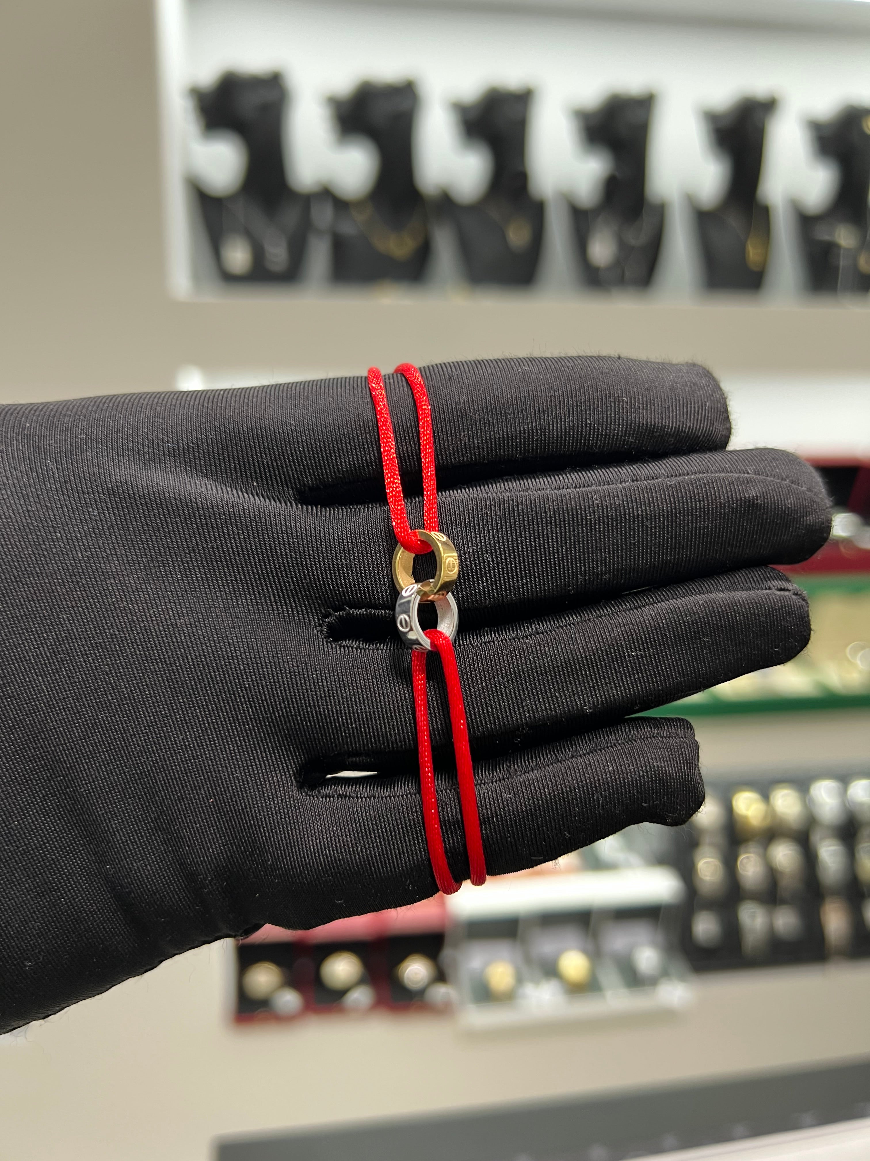 سوار خيط احمر حلقتين ذهبي في الفضي