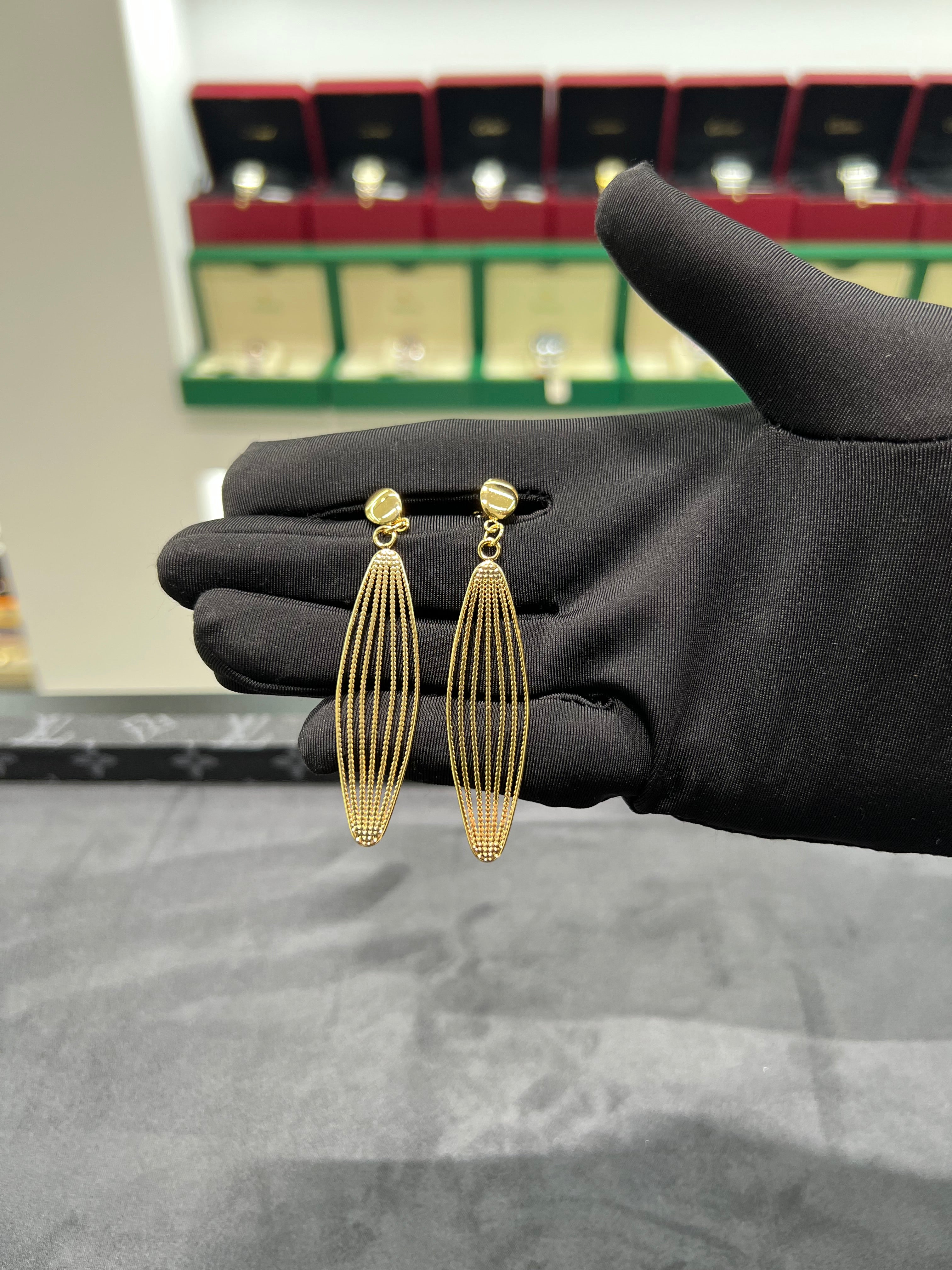 أقراط أذن الريشه الذهبيه