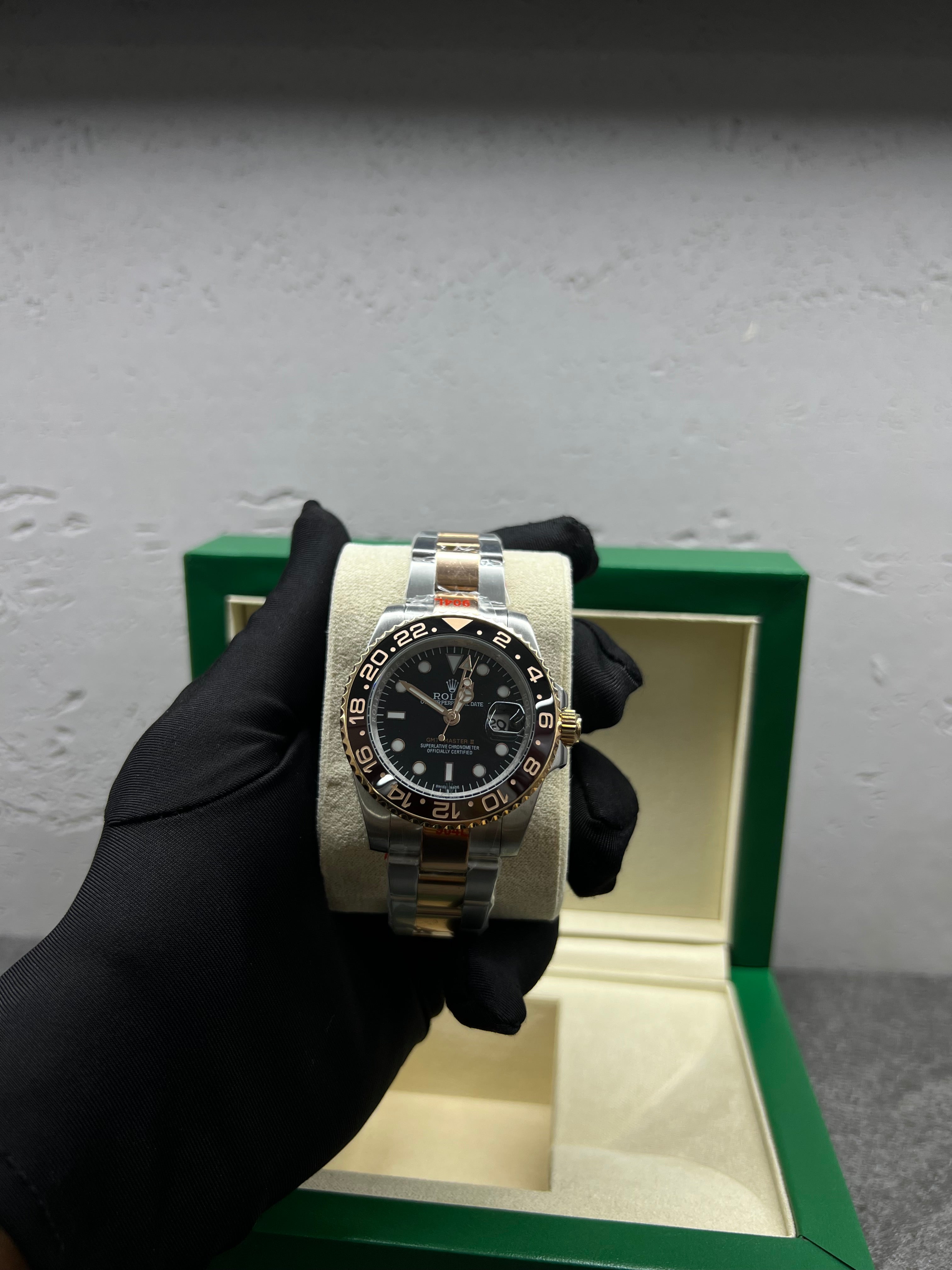 ساعة Root Beer روت بير ثنائية اللون بمينا أسود وإطار سيراميك بني — ستانلس وذهبي | Root Beer Two-Tone Watch