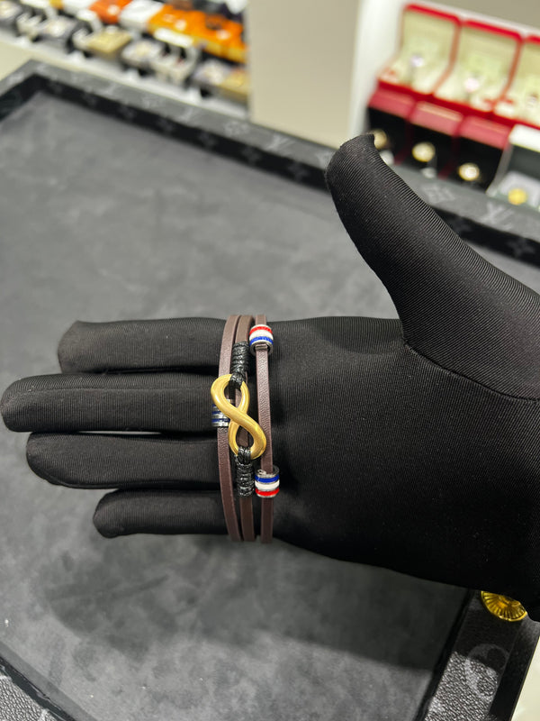 سوار جلد أسود بعقدة اللانهاية الذهبية | Black Leather Infinity Bracelet – Gold
